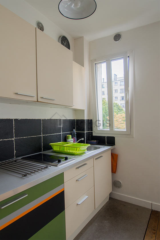 Bright kitchen with double-glazed windows facing the courtyard