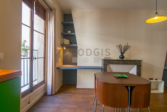 Living room with windows facing the courtyard