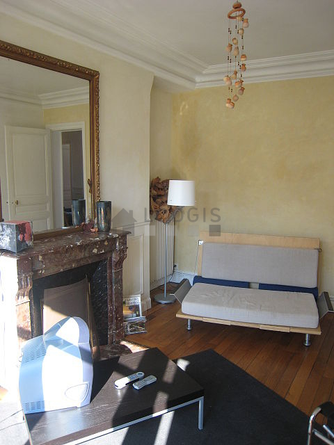 Living room with double-glazed windows and balcony facing the road