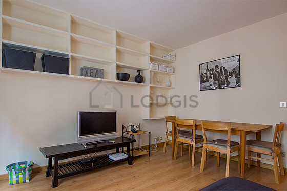 Living room with double-glazed windows facing the road