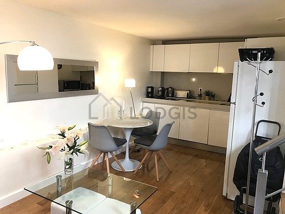Great kitchenopens on the living room with wooden floor