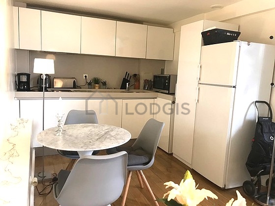 Kitchen where you can have dinner for 2 person(s) equipped with washing machine, dryer, refrigerator, extractor hood