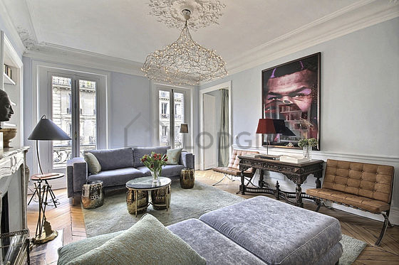 Living room with windows facing the road
