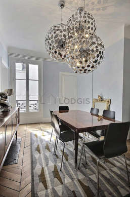 Dining room equipped with dining table, sideboard