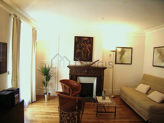 Living room with double-glazed windows facing the road