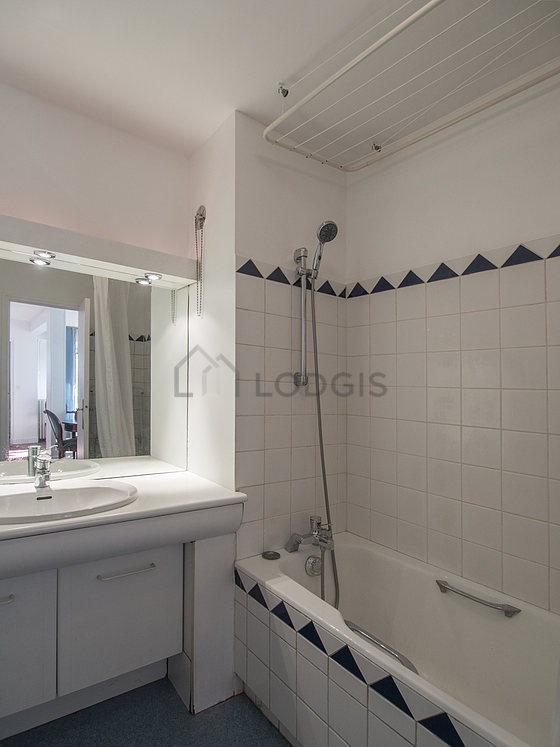 Bathroom equipped with washing machine, bath towels