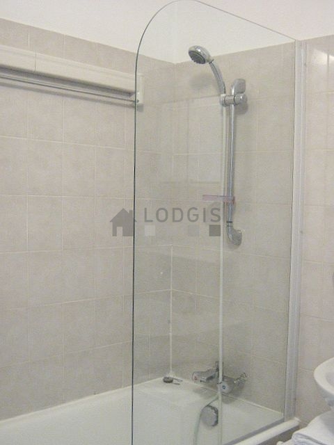 Bathroom equipped with washing machine, bath towels