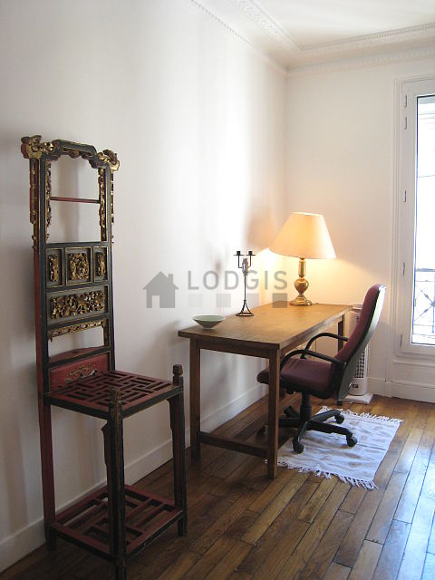 Bedroom with wooden floor
