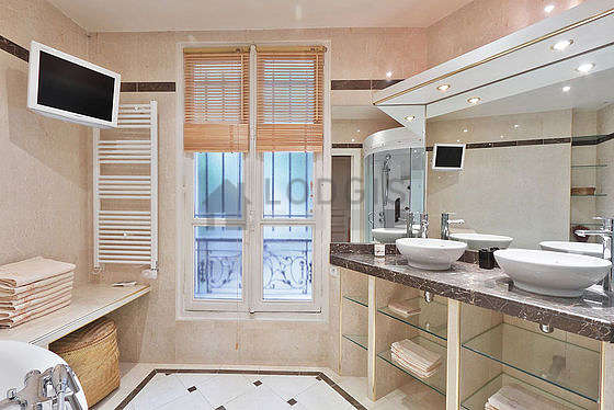 Pleasant bathroom with double-glazed windows and with tilefloor
