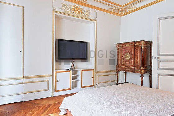 Very bright bedroom equipped with tv
