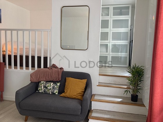 Quiet living room furnished with sofa, 2 chair(s)