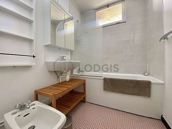 Bright bathroom with windows and with tilefloor
