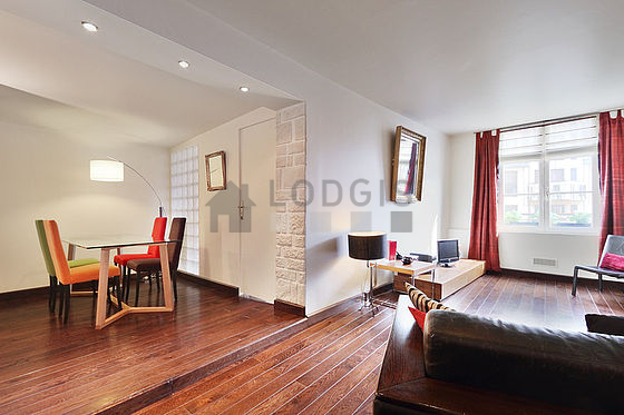 Living room with double-glazed windows facing the road