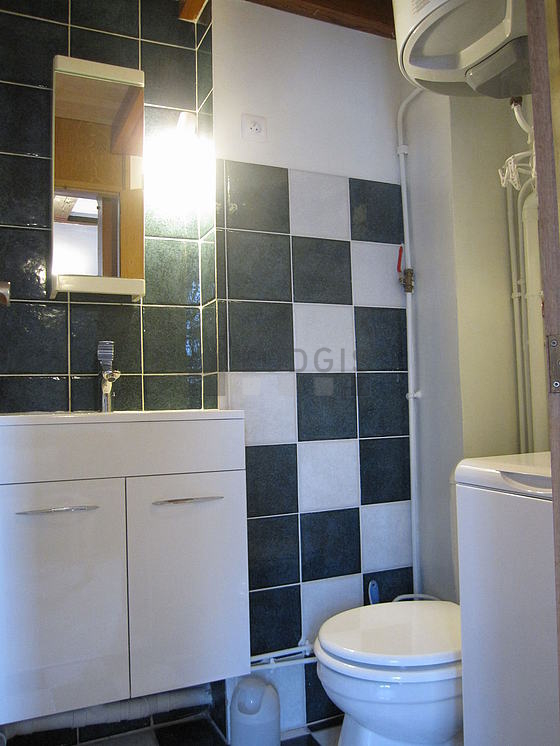 Bathroom equipped with washing machine, bath towels