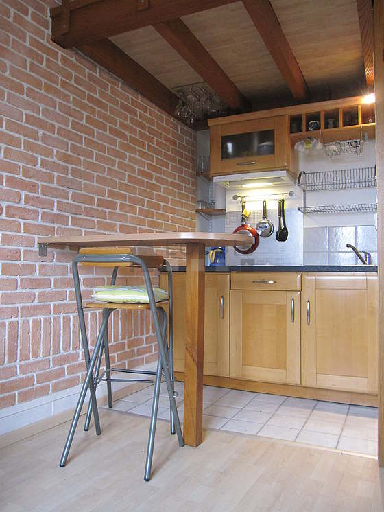 Kitchen where you can have dinner for 2 person(s) equipped with hob, refrigerator, freezer, extractor hood