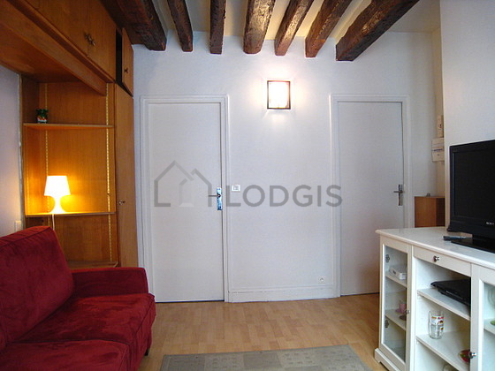 Living room with double-glazed windows facing the road