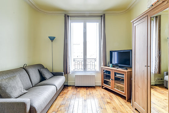 Very quiet living room furnished with 1 sofabed(s) of 140cm, tv, closet, 2 chair(s)