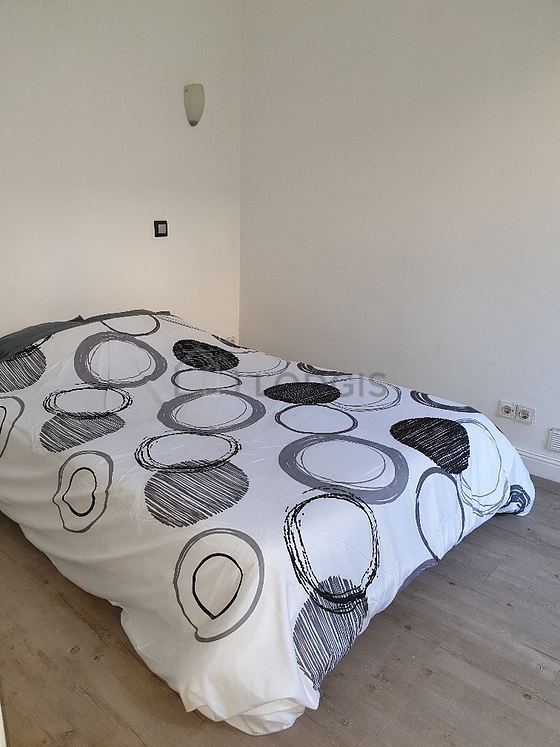 Bedroom with wooden floor