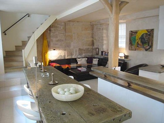 Very quiet living room furnished with hi-fi stereo, 1 armchair(s)