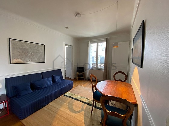 Living room with windows facing the courtyard