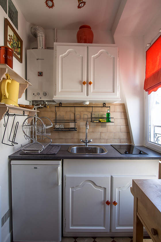 Bright kitchen with double-glazed windows facing the courtyard