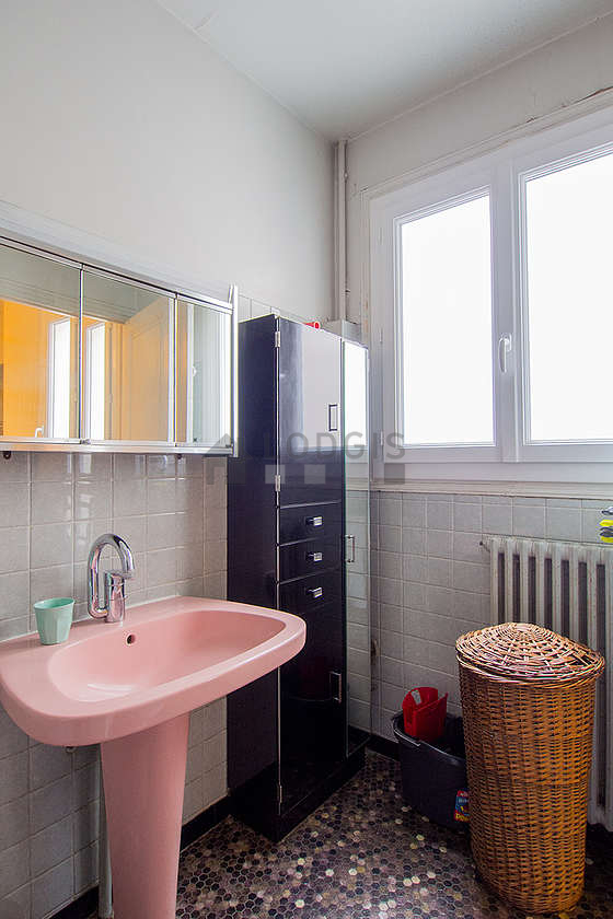 Bathroom equipped with washing machine, bath towels