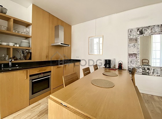 Very bright kitchen with windows facing the courtyard