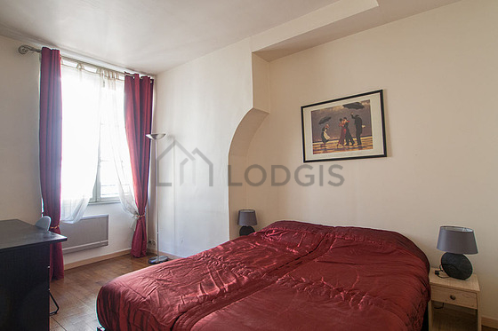Bedroom with wooden floor