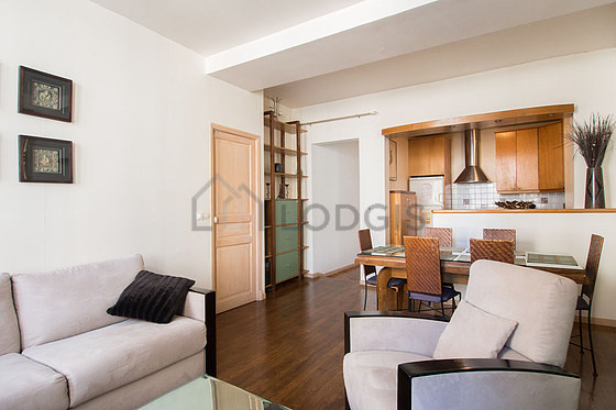 Bright living room furnished with 6 chair(s)