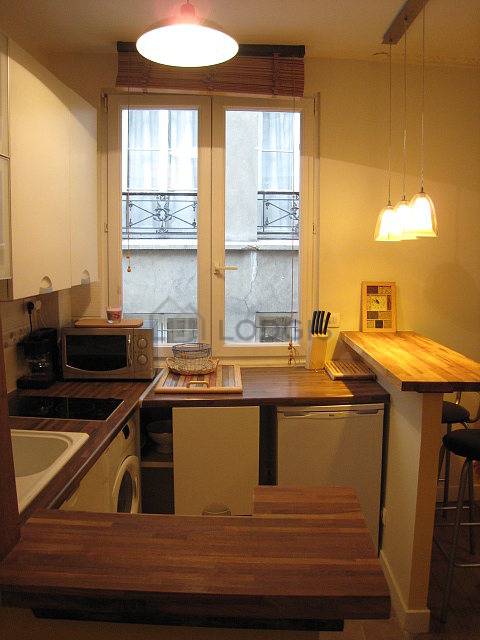 Kitchen with double-glazed windows facing the courtyard