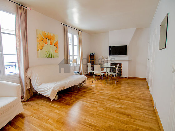 Living room with windows facing the courtyard