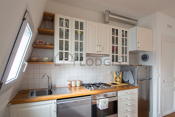 Bright kitchen with windows facing the road