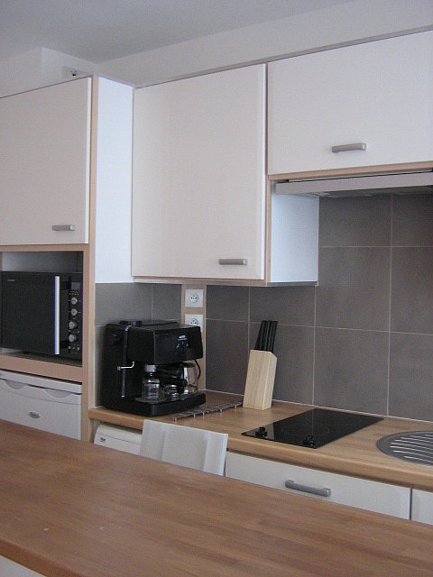 Kitchen where you can have dinner for 2 person(s) equipped with washing machine, refrigerator, freezer, extractor hood