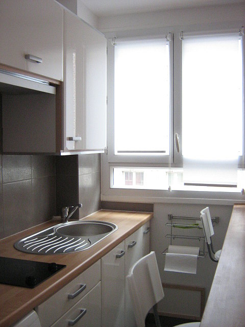 Very bright kitchen with double-glazed windows facing the road
