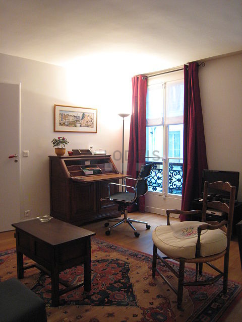 Living room with windows facing the courtyard