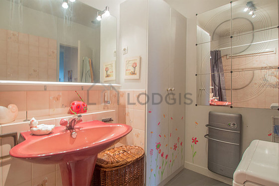 Bathroom equipped with washing machine, bath towels