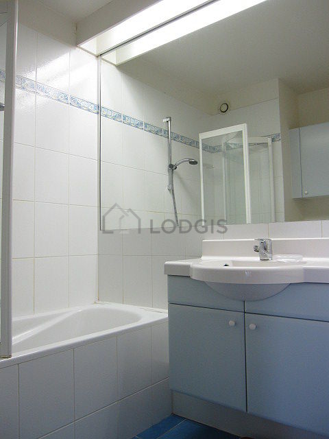 Bathroom equipped with washing machine, shelves