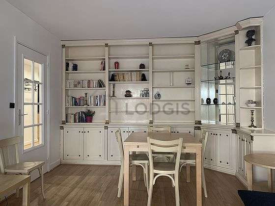 Bright living room furnished with cupboard, 4 chair(s)