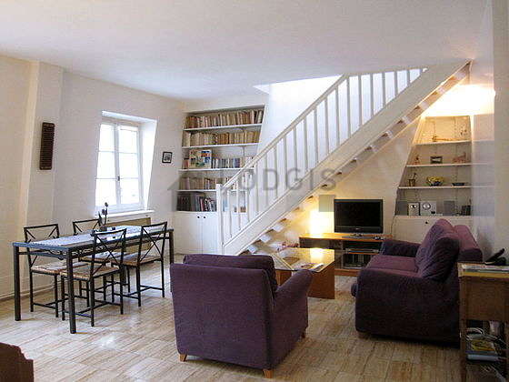 Very quiet living room furnished with tv, hi-fi stereo, 1 armchair(s), 4 chair(s)