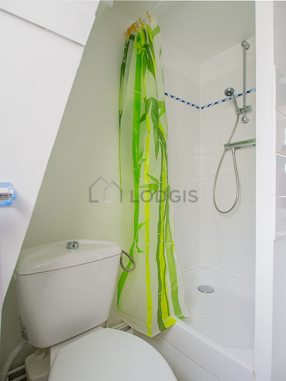 Bathroom equipped with washing machine, bath towels